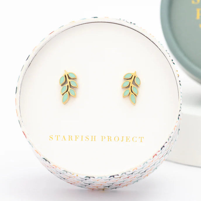 Gold leaf earrings in a white box with 'Starfish Project' branding.