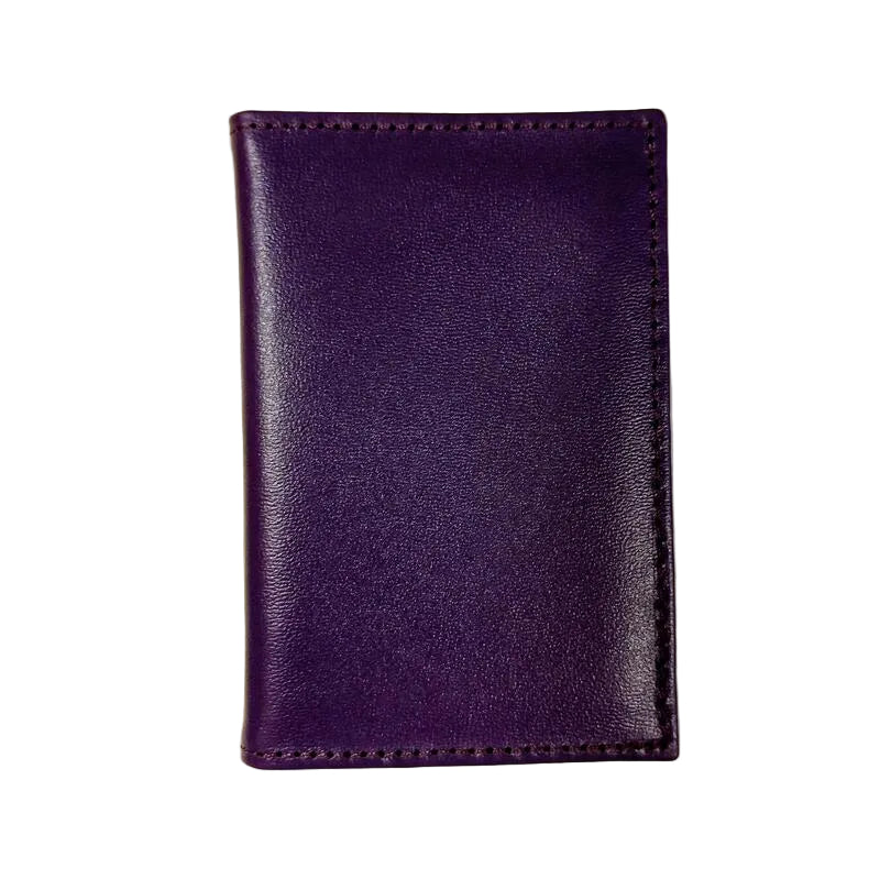 Purple leather wallet on a light beige background