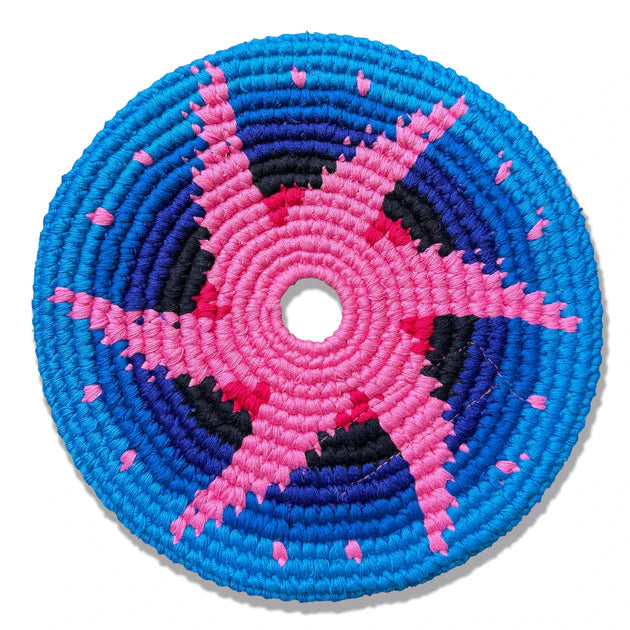 Circular woven flying disk with pink and blue concentric pattern on a white background