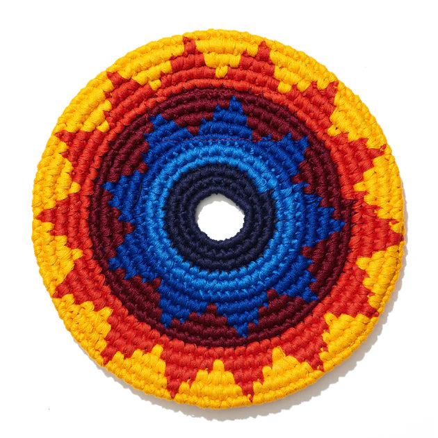 Colorful flying disk with concentric patterns on a white background