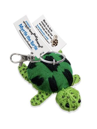 Green turtle-shaped keychain with a tag on a white background