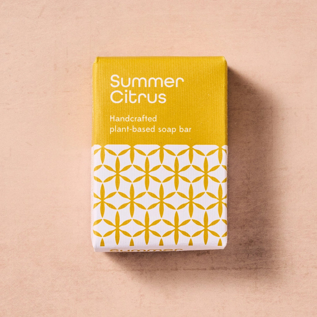 Handcrafted plant-based soap bar packaging with 'Summer Citrus' text on a beige background
