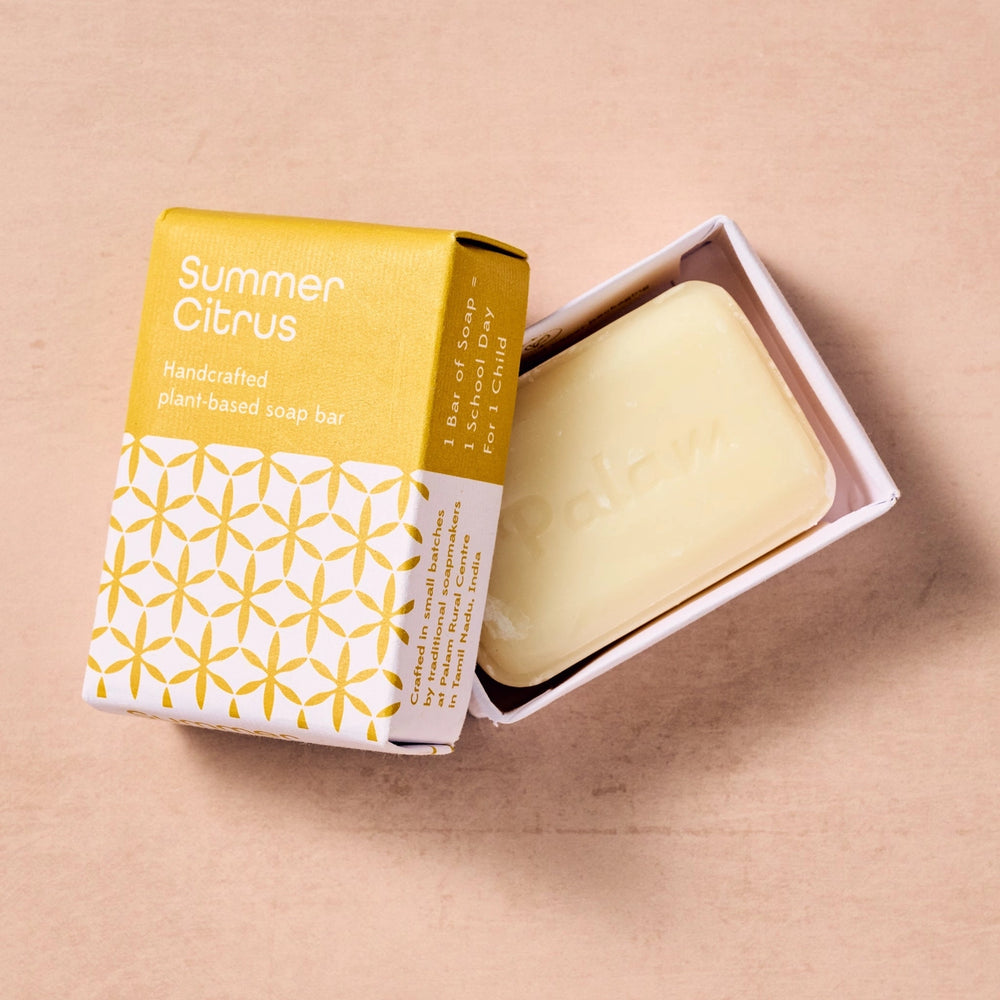 Bar of soap with 'Summer Citrus' packaging on a beige background