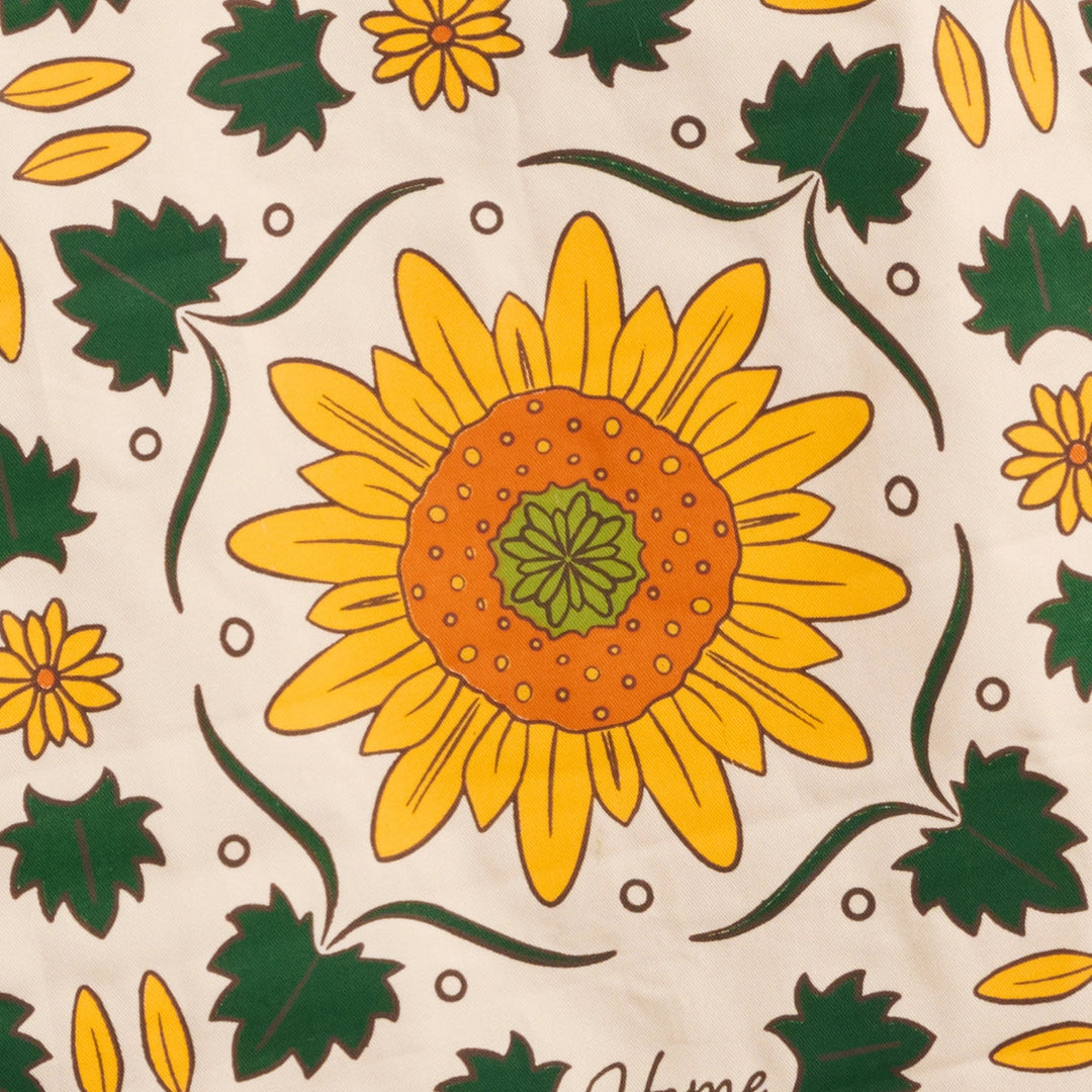 Pattern of sunflowers and leaves on a beige background