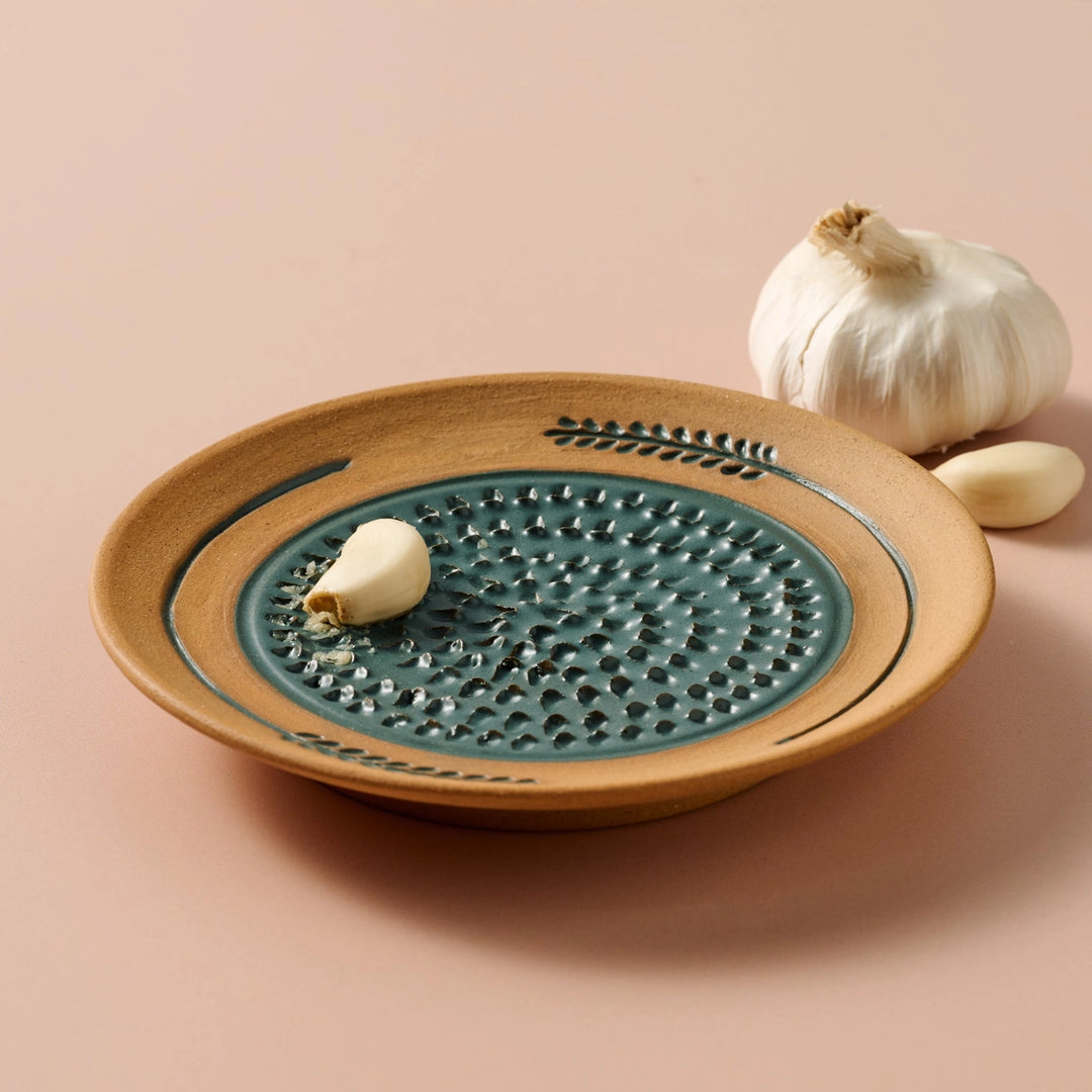 Ceramic dish with textured design on a beige background