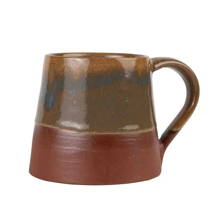 Brown ceramic mug with a handle on a white background