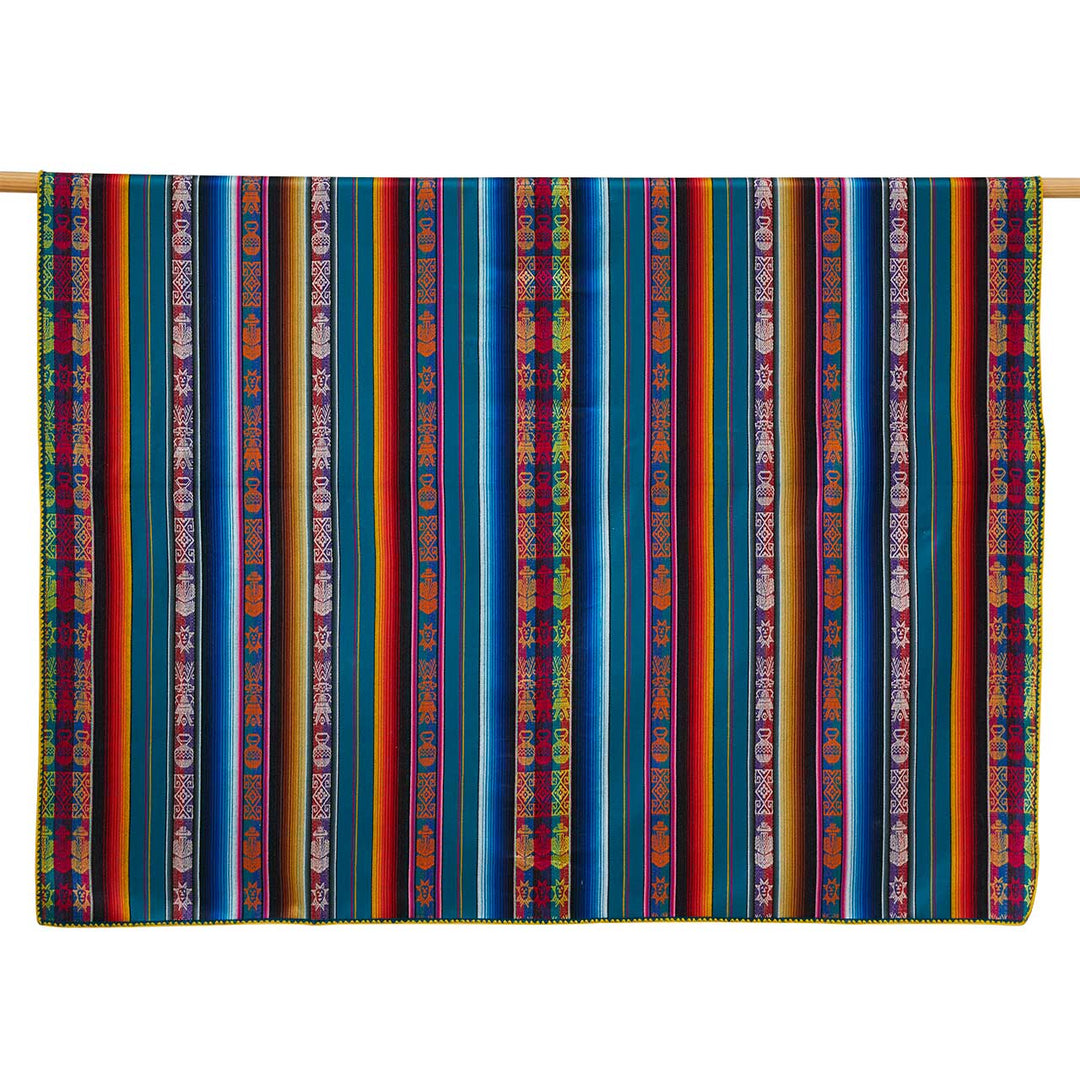 Multicolored striped fabric with patterns on a wooden rod