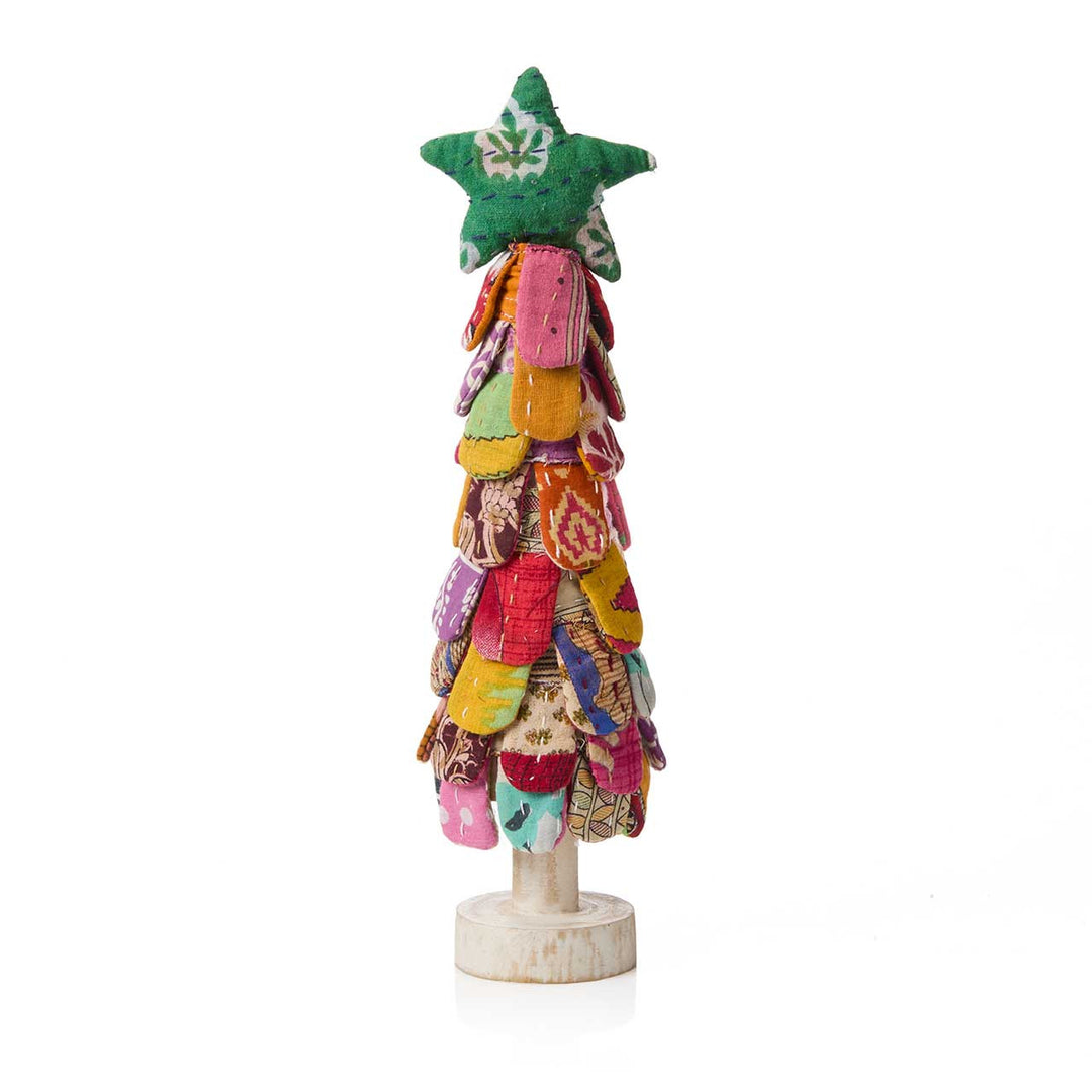 Colorful patchwork Christmas tree with a star on top against a white background