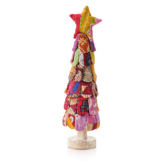 Colorful patchwork tree sculpture on a white background