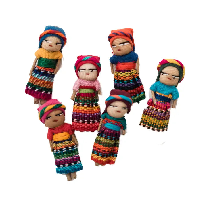 Set of colorful dolls with traditional attire on a white background
