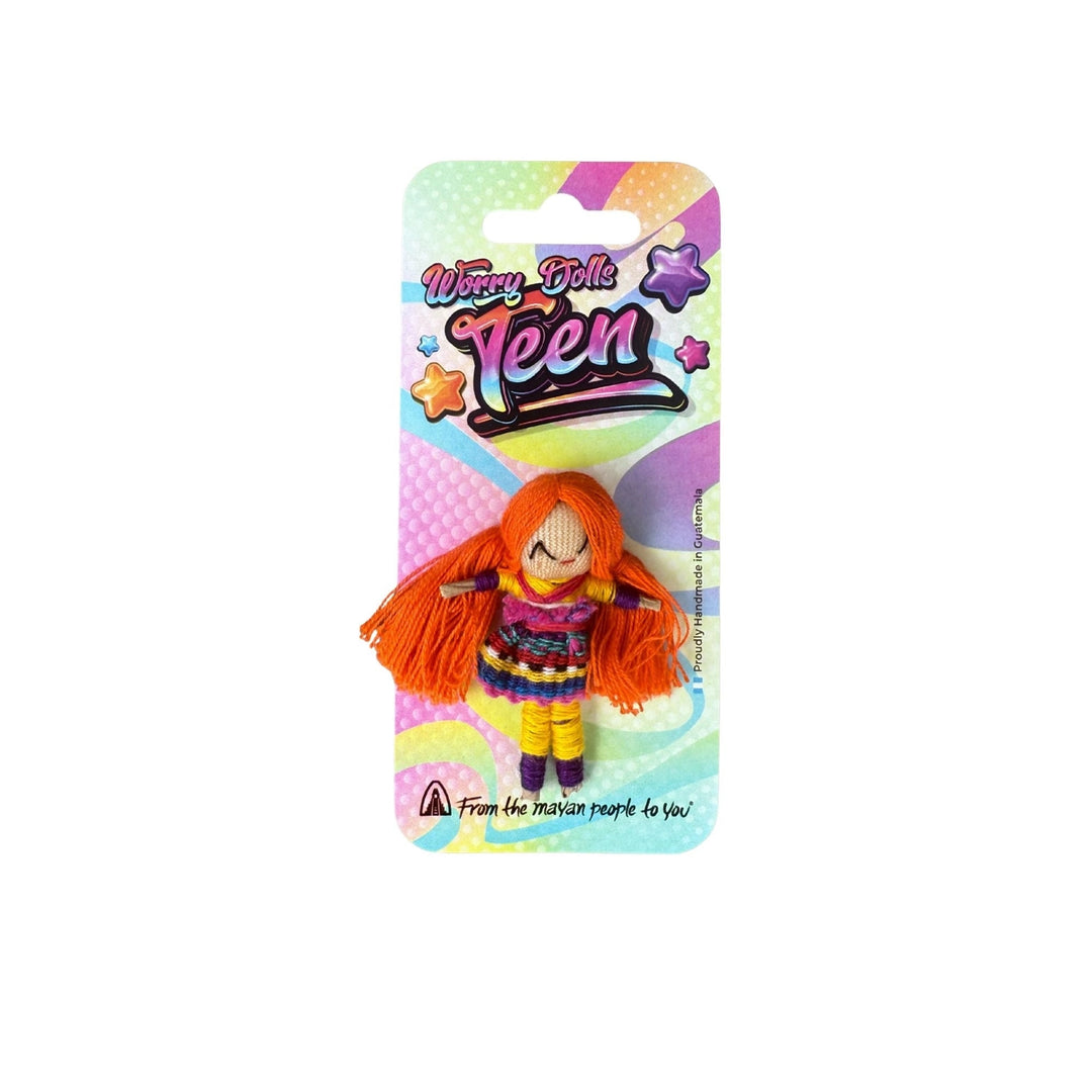 Toy worry doll with red hair on a colorful packaging background