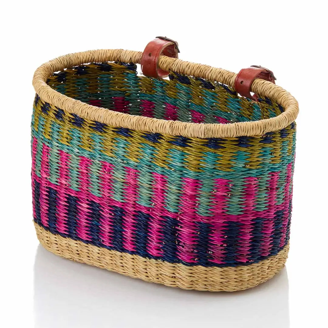 Woven bike basket with colorful pattern on a white background