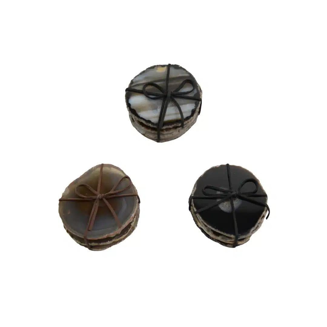 Three sets of round natural color agate coasters on a white background