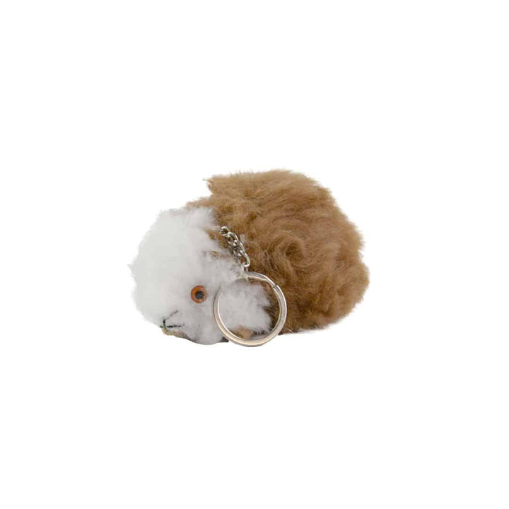 A fluffy guinea pig keychain made of alpaca fur, with a metal ring attached for a keychain.