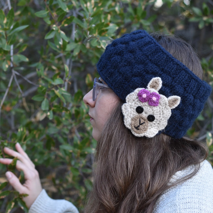 woman wearing a blue alpaca ear warmer