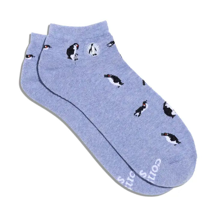 Blue ankle sock with penguins pattern on a white background