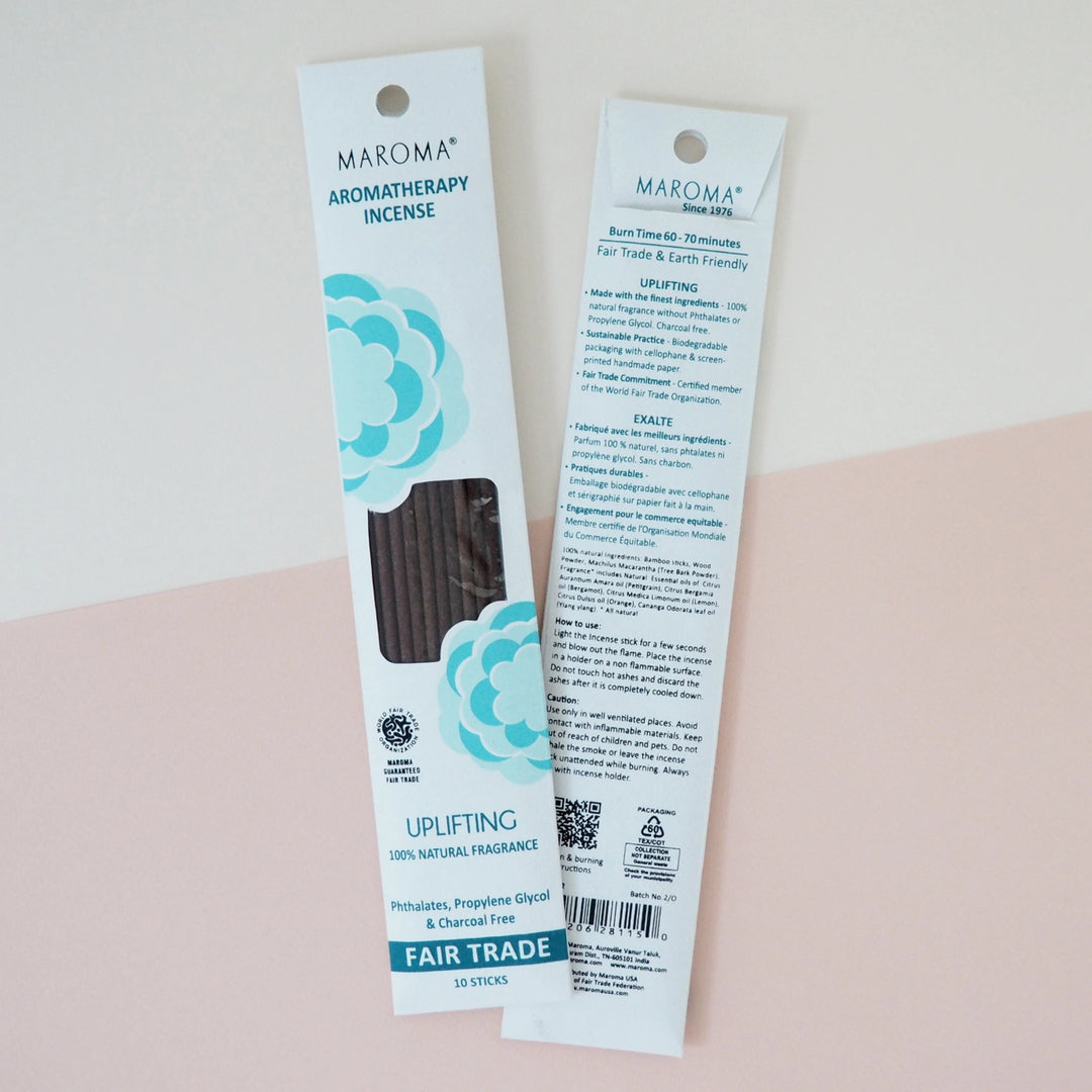 Two packages of Maroma Aromatherapy Incense on a light pink background