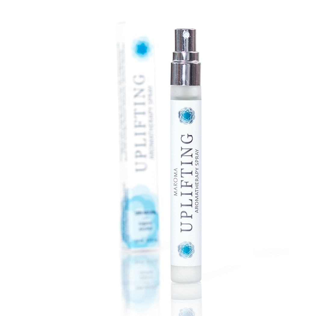 Uplifting aromatherapy spray bottle on a white background