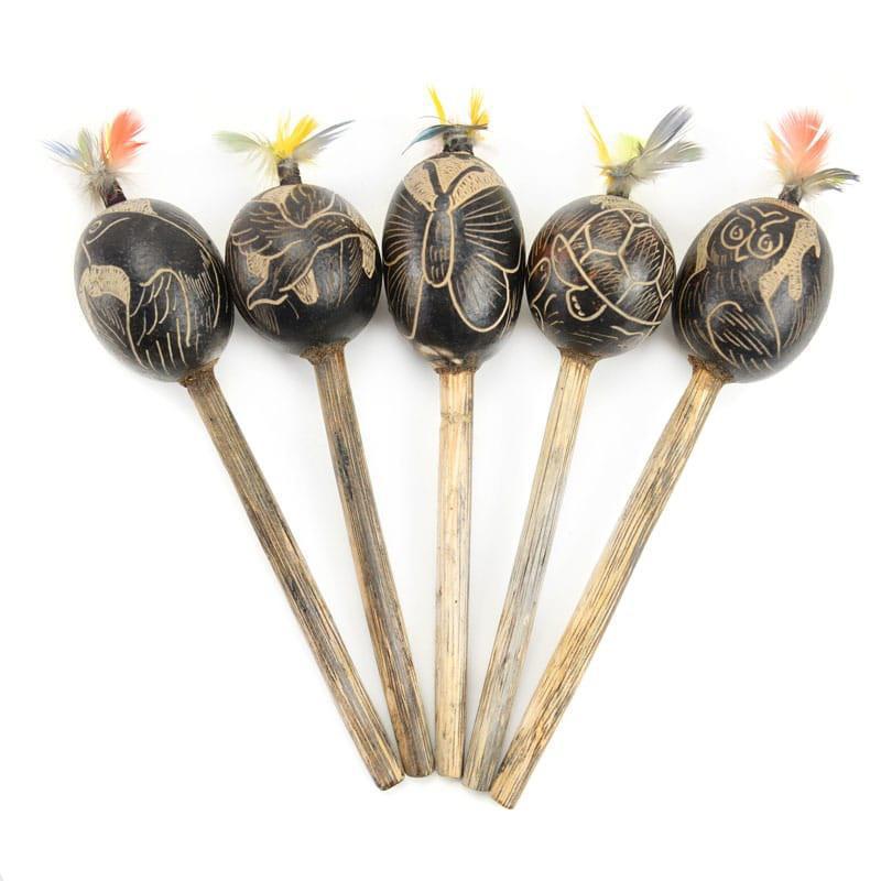 A set of four Artisan Calabash Maraca with etched designs and feather details on a light background.