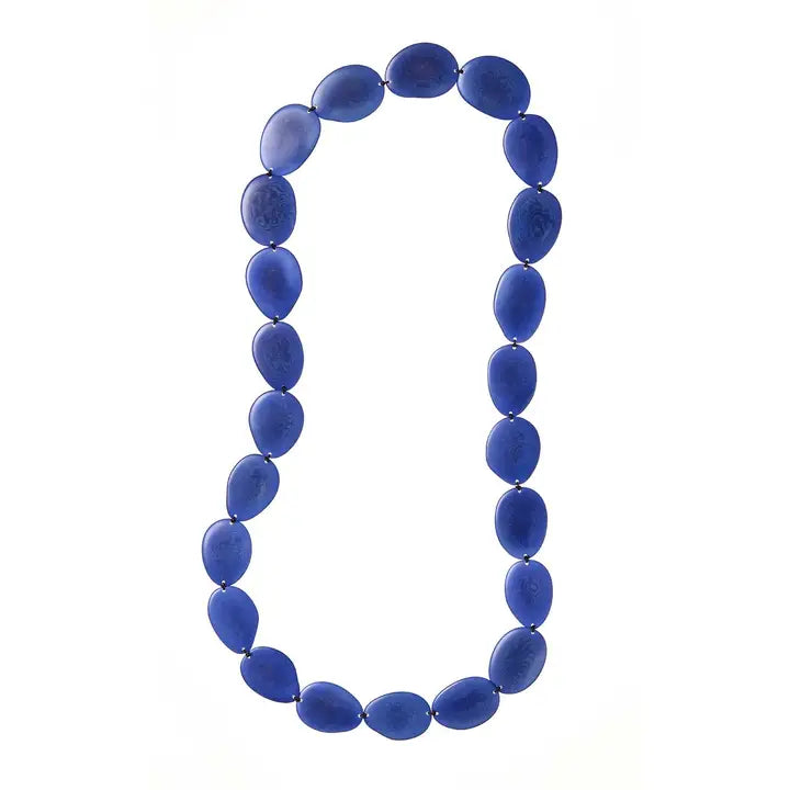 Blue tagua beaded necklace on a white background