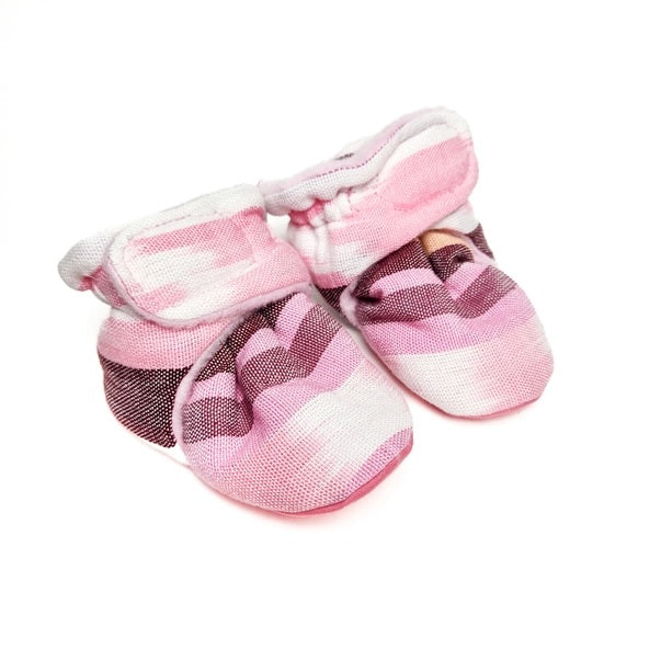 Pair of pink and white striped baby shoes on a white background