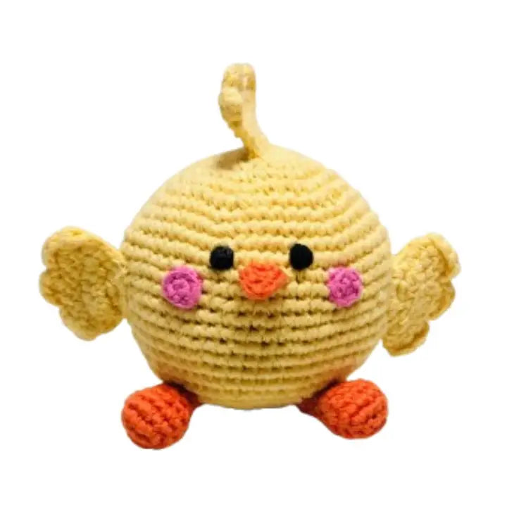 Crocheted yellow chick toy with pink flowers on a white background