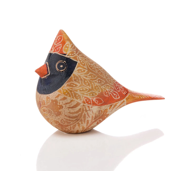 a batik female cardinal on a white background