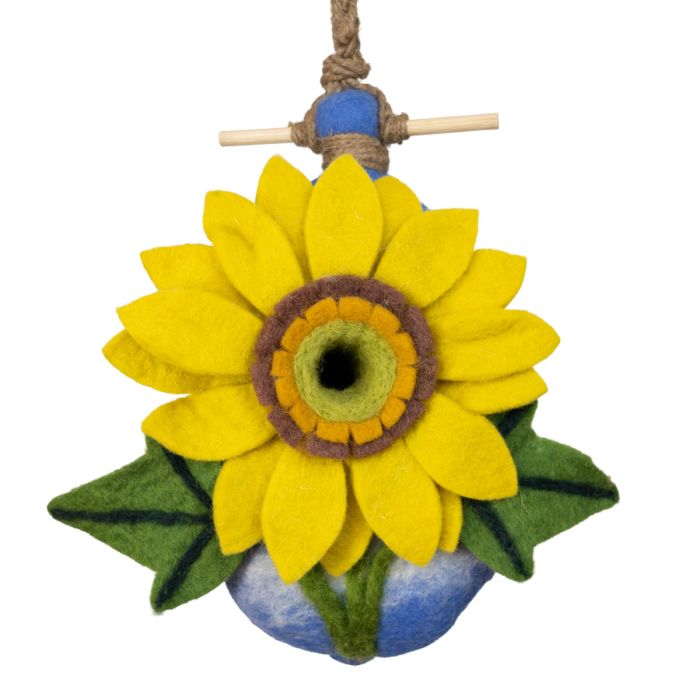 Felt sunflower birdhouse with green leaves on a white background