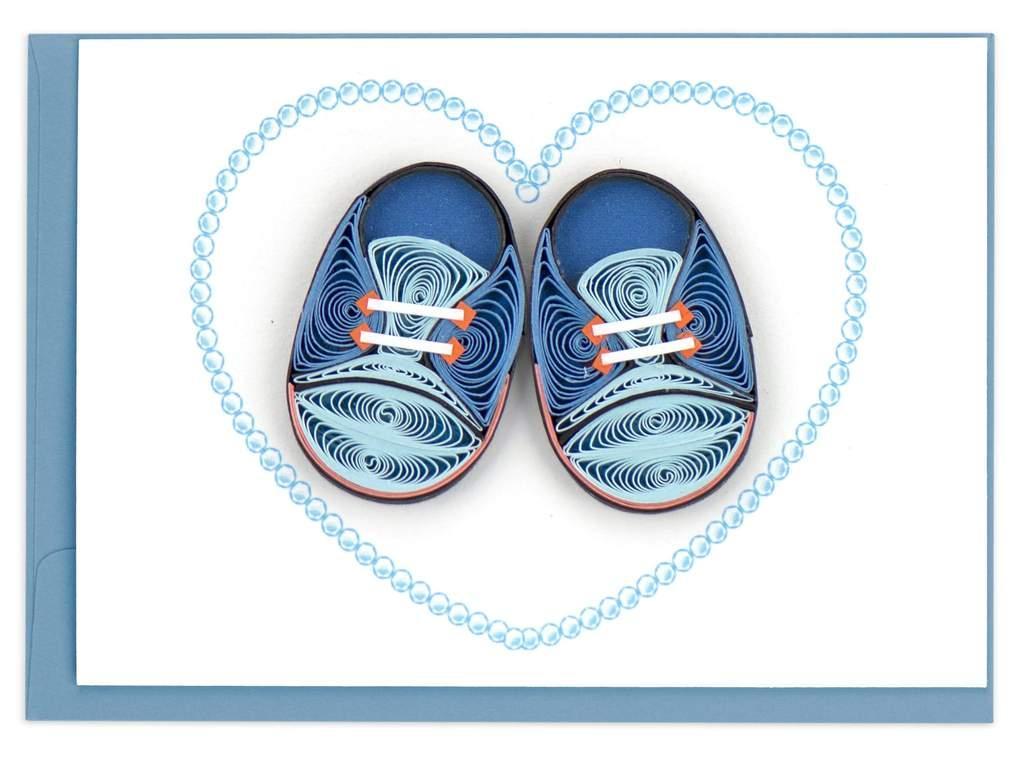 Blue children's shoes with white laces on a white background