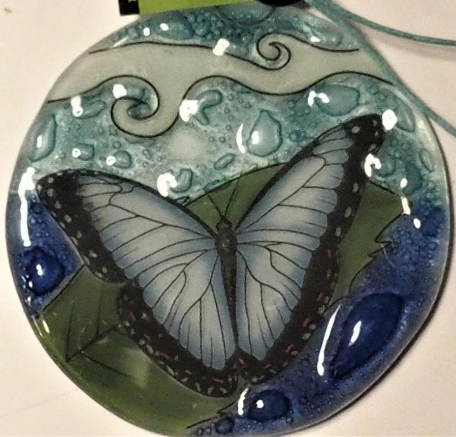 Glass ornament with blue butterfly