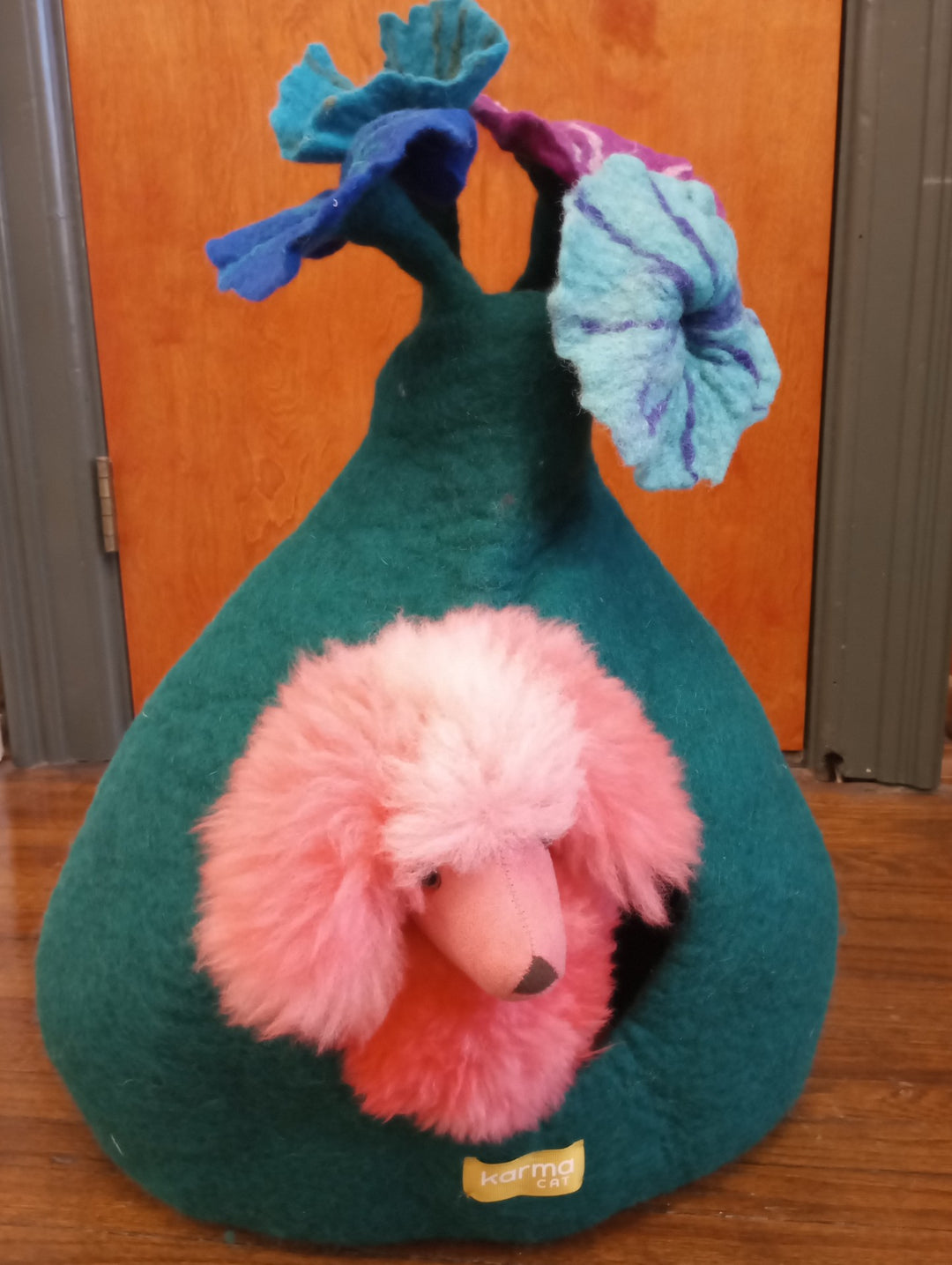 A blue cat cave by Karma Cat with a pink poodle. 
