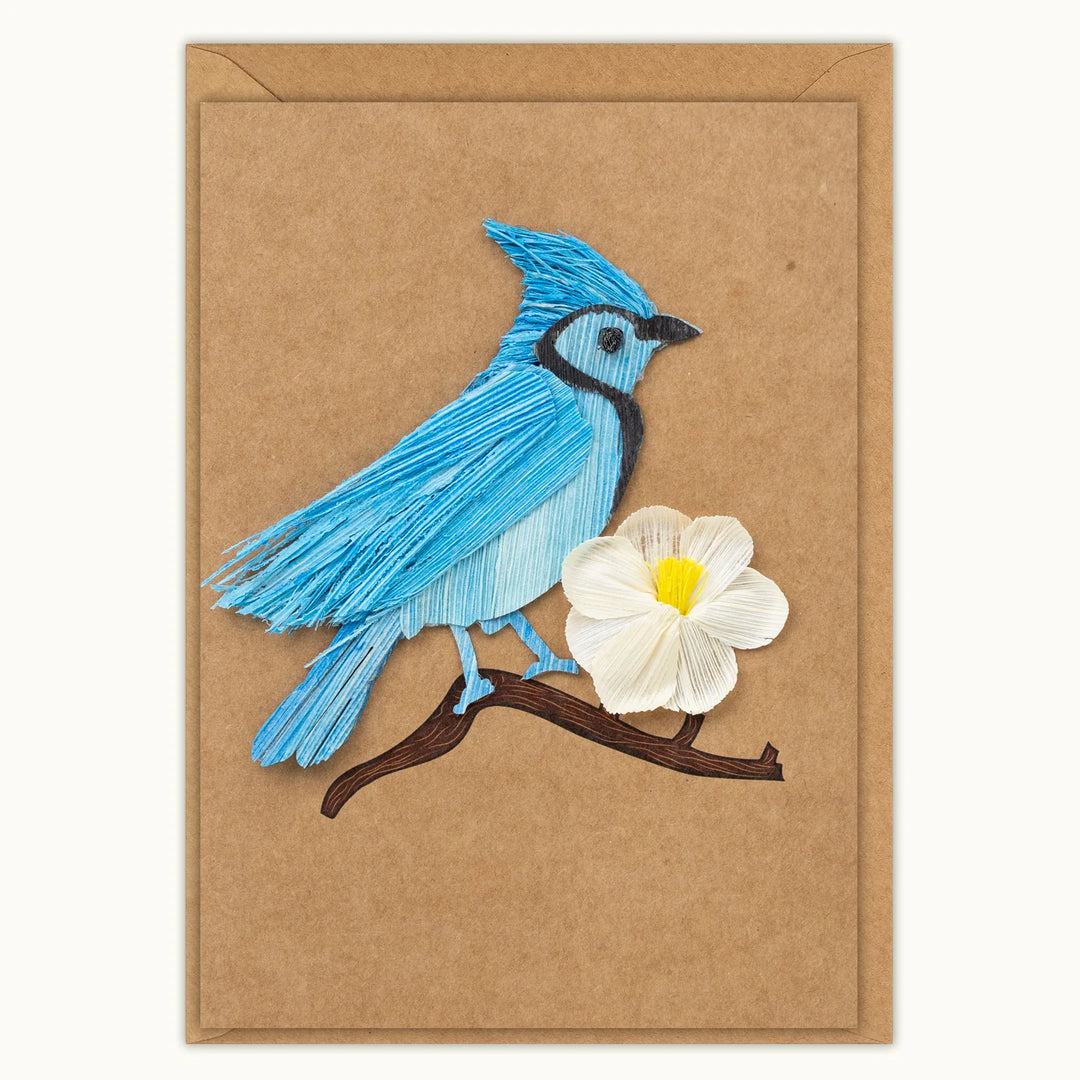 Card with a blue bird and white flower on a brown background