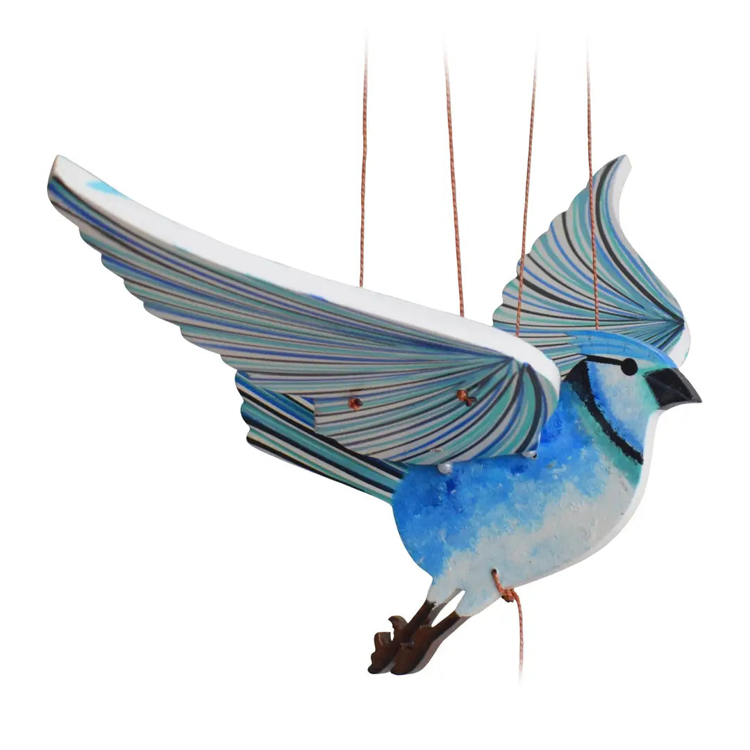Decorative blue jay flying mobile with blue and white feathers on a white background