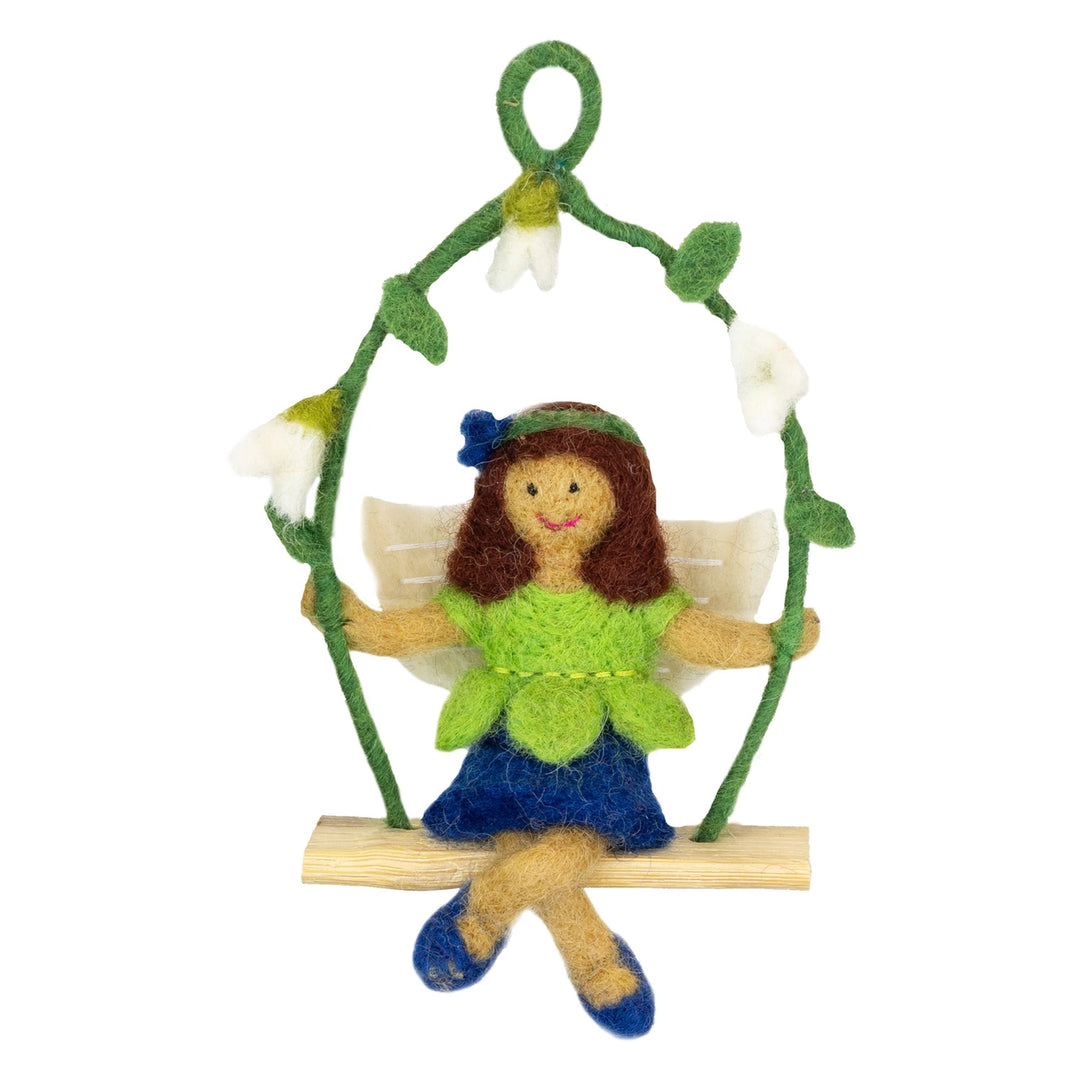 Felt fairy sitting on a branch with flowers on a white background