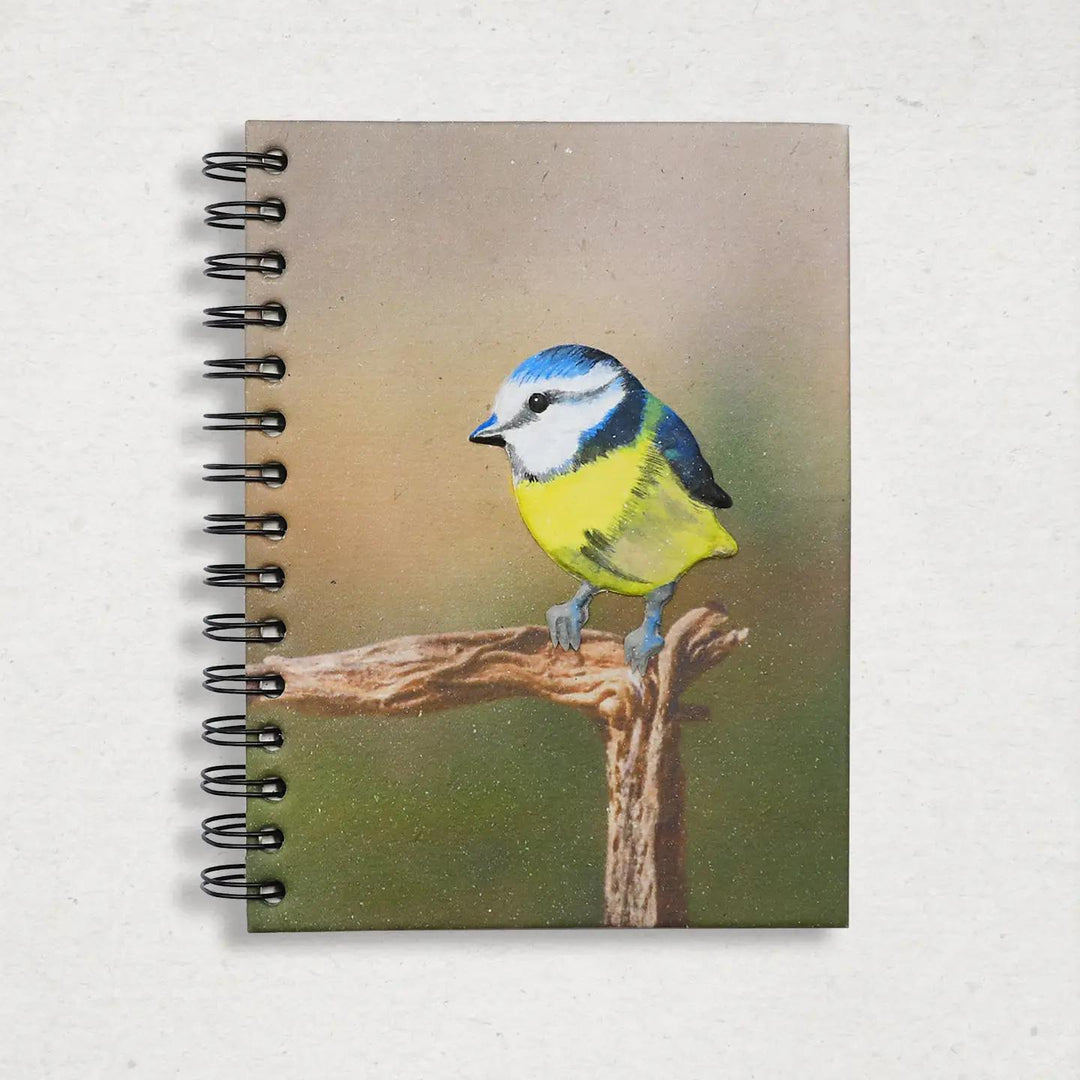 Mr. Ellie Pooh notebook with a bird illustration on the cover against a white background