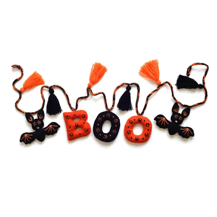 Halloween-themed decorative garland with black, orange, and red elements on a white background