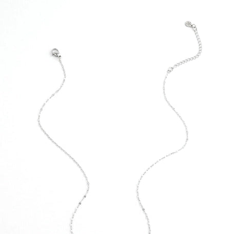 Silver necklace with a bar pendant on a white background