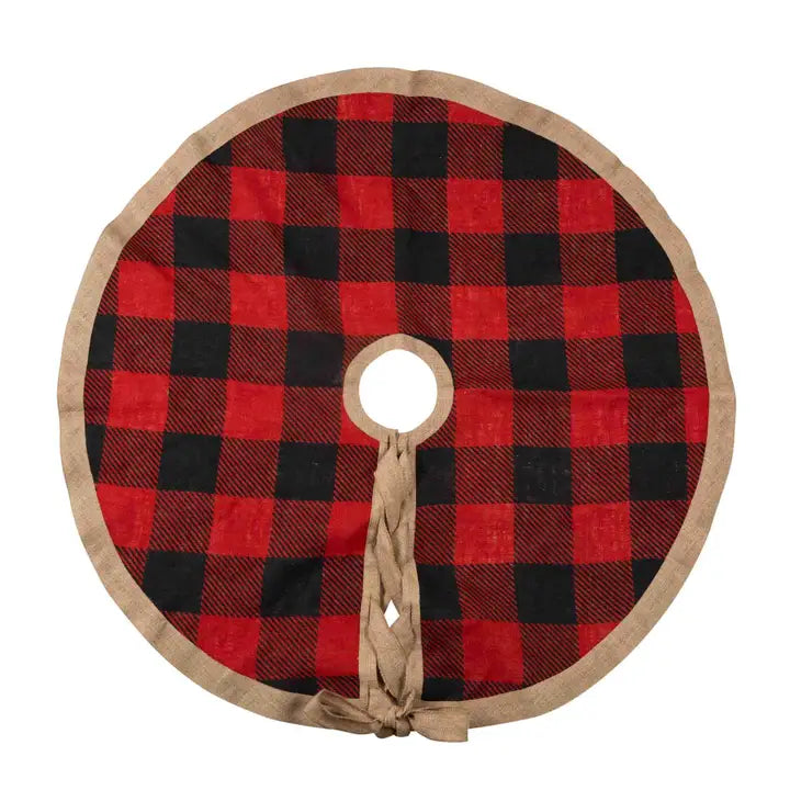 A round tree skirt with a classic red and black buffalo plaid pattern, finished with a natural jute trim and a braided jute hanging loop at the center.