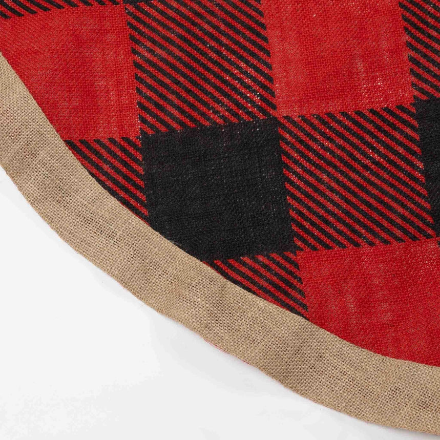 A close-up of a red and black buffalo plaid fabric with a natural tan jute trim, shown on a white background.