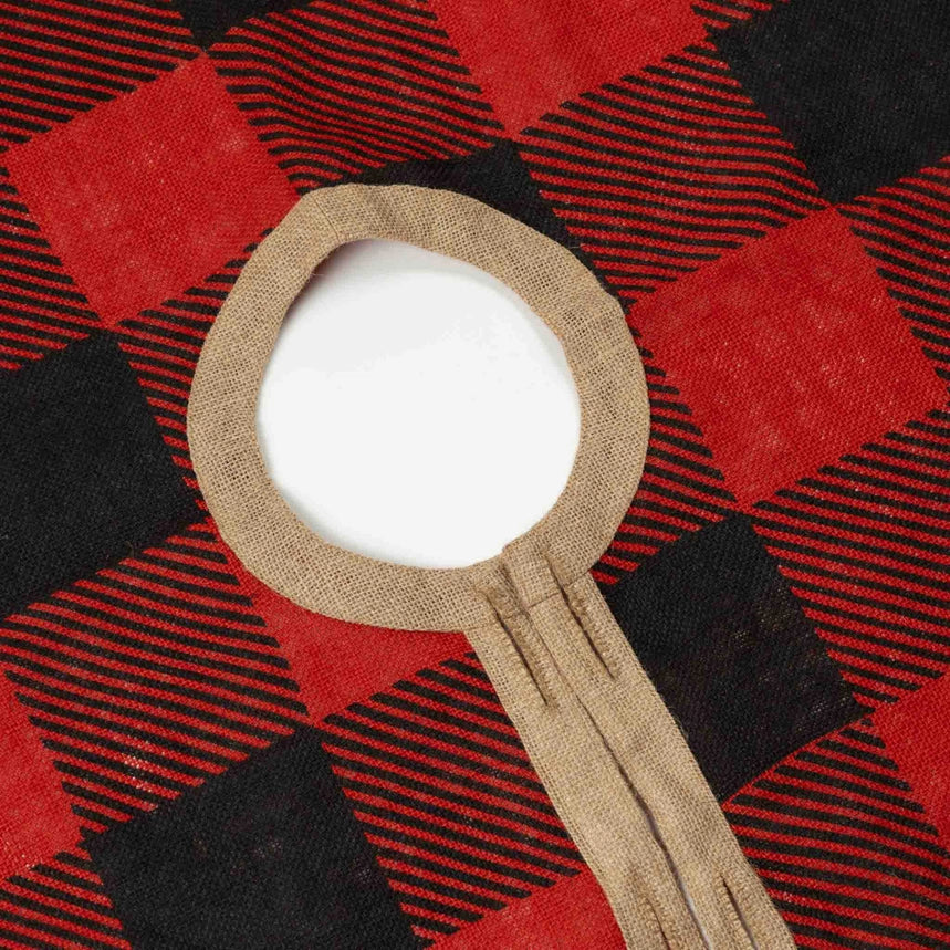 A close-up of a round buffalo plaid tree skirt.