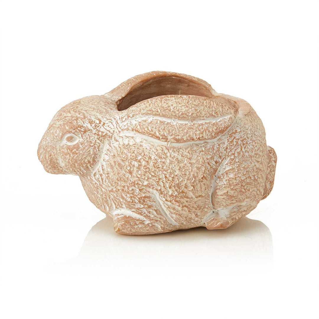 Terracotta rabbit-shaped planter with a textured surface on a white background