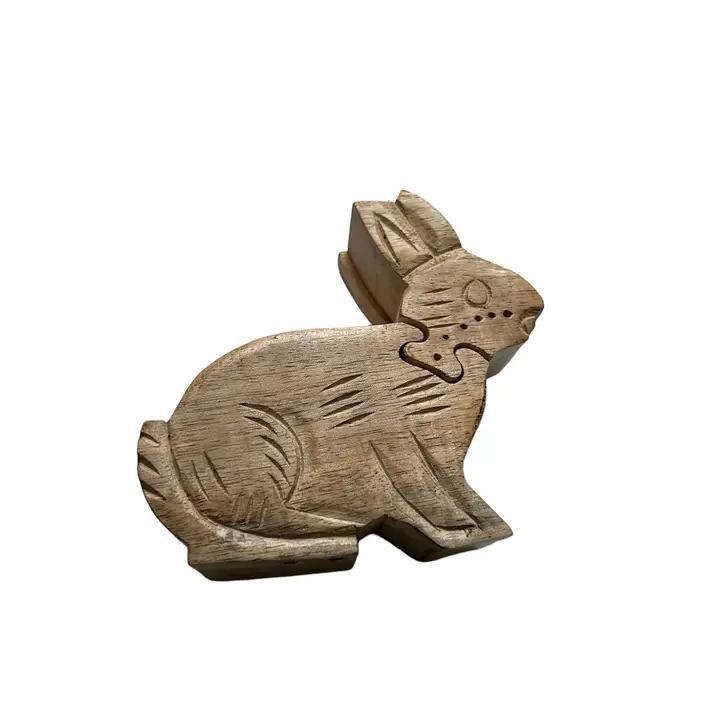 Hand-carved wooden puzzle box in the shape of a bunny.