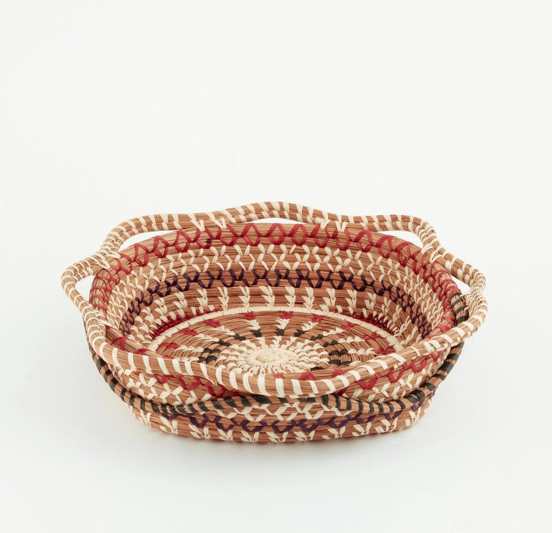 Handwoven baskets with a striped pattern on a white background