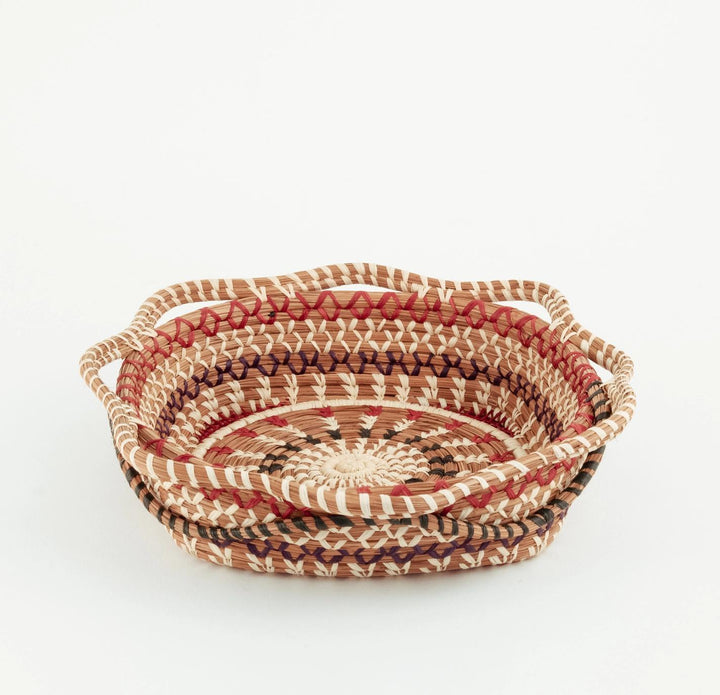 Handwoven baskets with a striped pattern on a white background