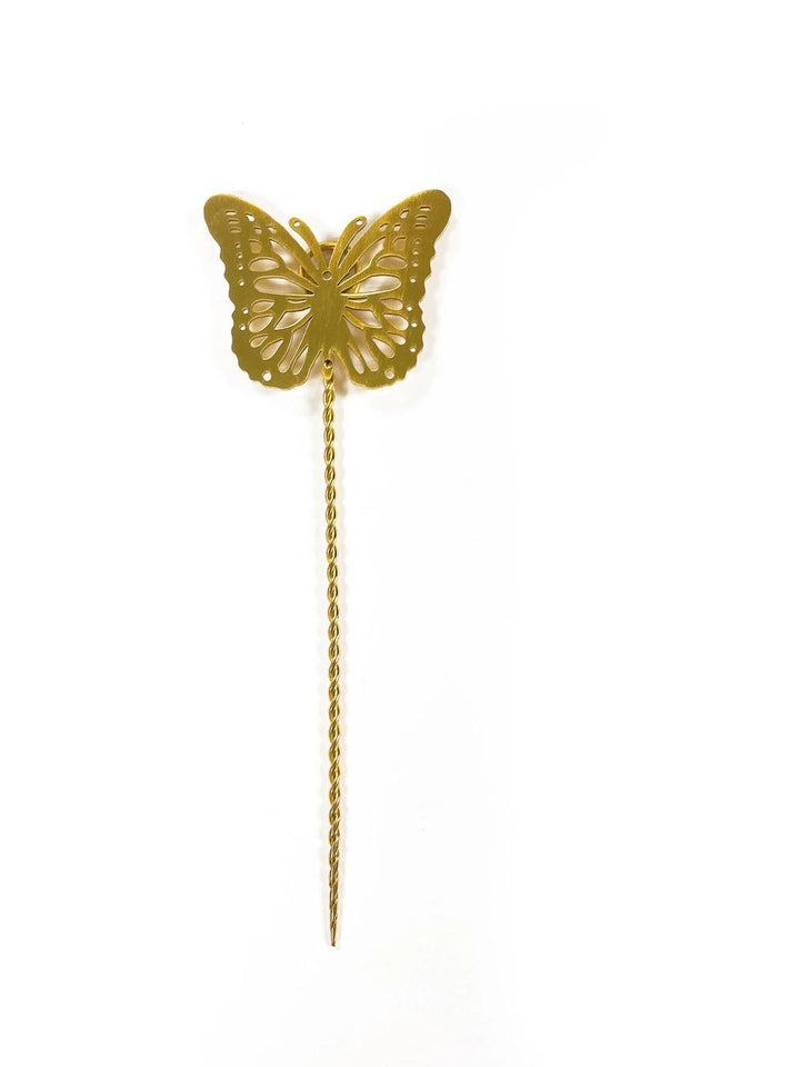 Gold butterfly-shaped plant stake on a white background