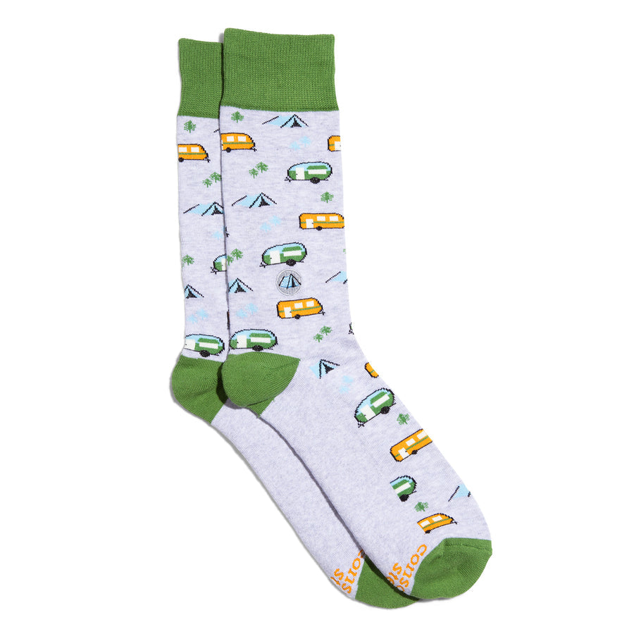 Pair of socks with camper and tent designs on a white background