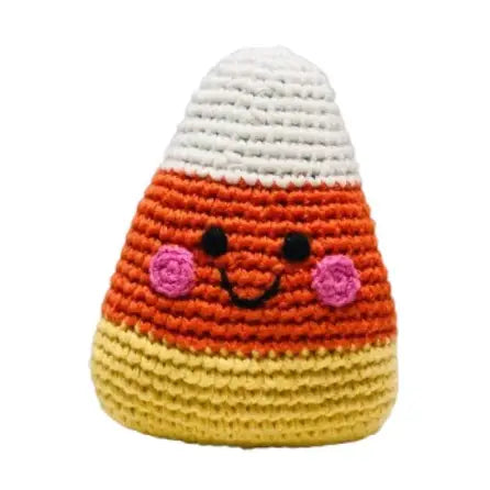 Crocheted candy corn toy with a happy face on a white background