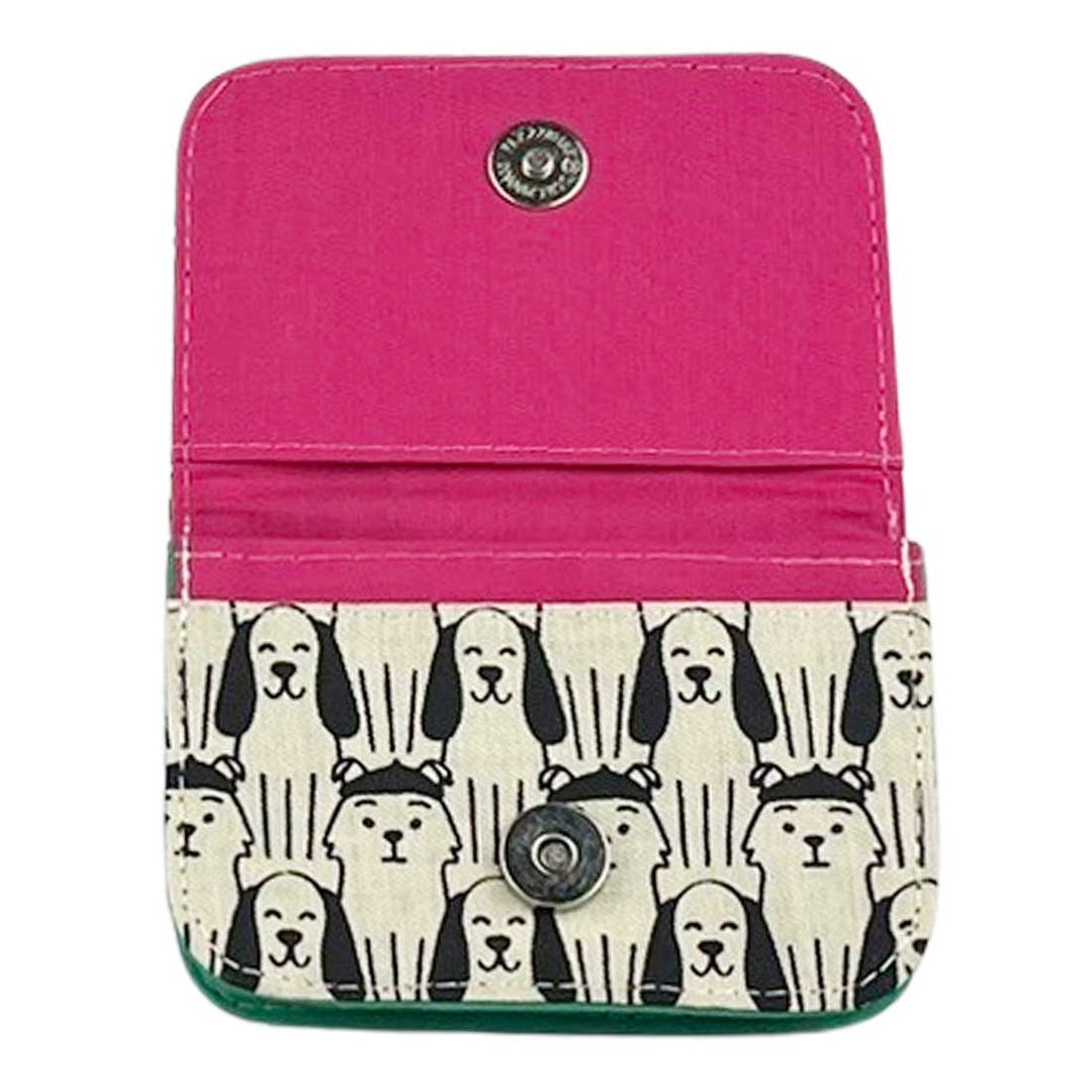 Pink wallet with dog pattern on a white background