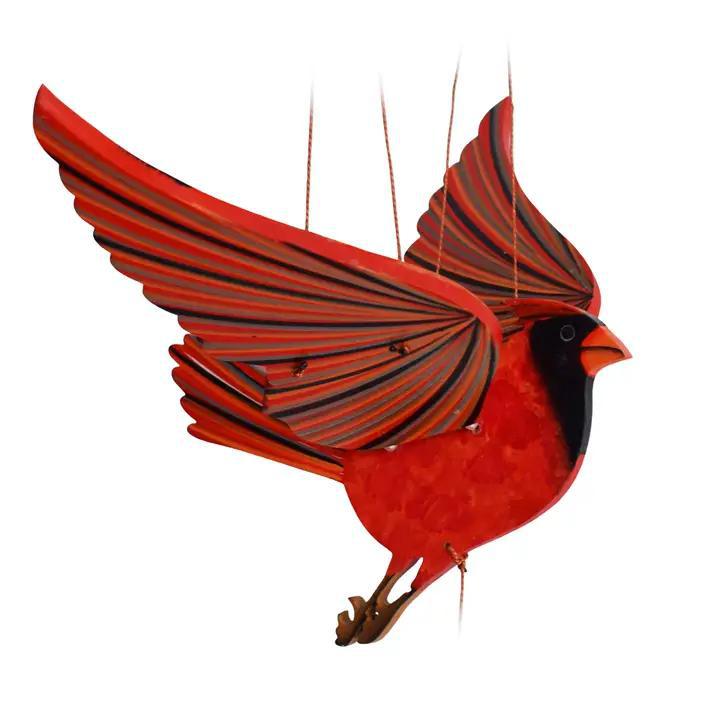 A red cardinal flying mobile on a white background