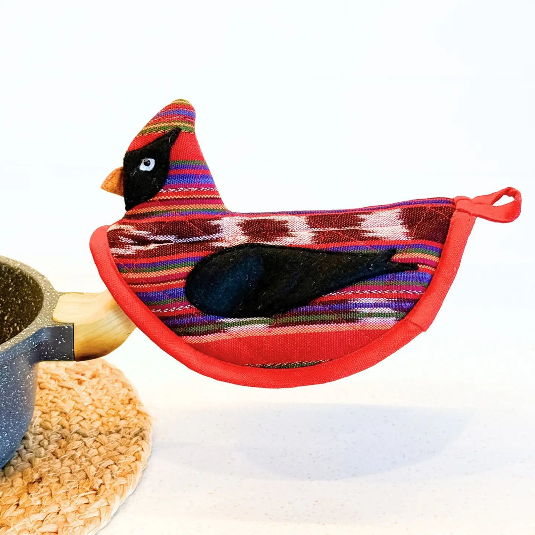 Colorful cardinal-shaped potholder on a white background